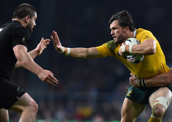 Australia's wing Adam Ashley-Cooper (R) runs to evade New Zealand's hooker Dane Coles  during the final match of the 2015 Rugby World Cup between New Zealand and Australia at Twickenham stadium, south west London, on October 31, 2015.  AFP PHOTO / GABRIEL BOUYS RESTRICTED TO EDITORIAL USE, NO USE IN LIVE MATCH TRACKING SERVICES, TO BE USED AS NON-SEQUENTIAL STILLS        (Photo credit should read GABRIEL BOUYS/AFP/Getty Images)